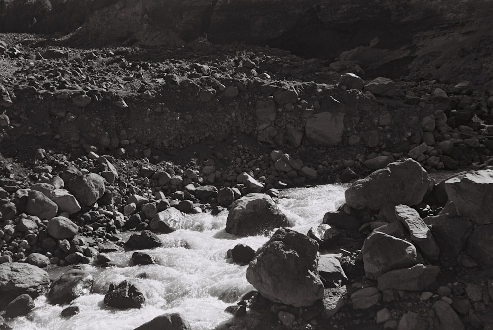 a stream of water running through a rocky area