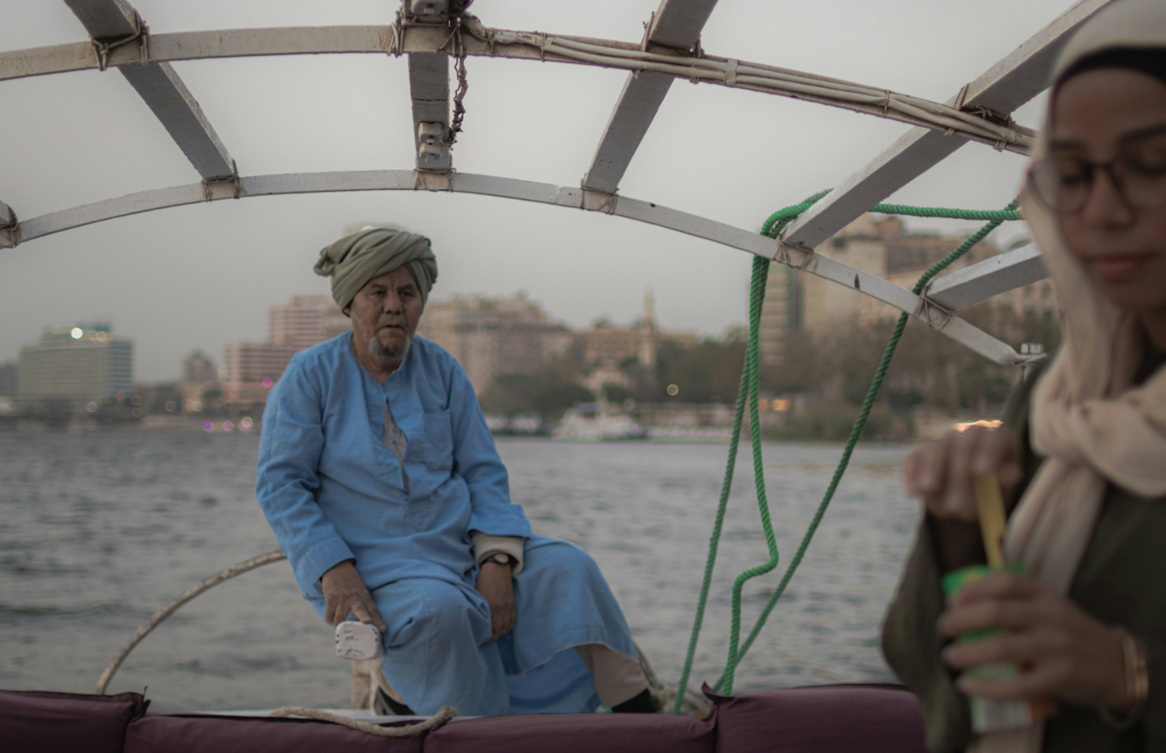 A man and a woman sitting on a boat