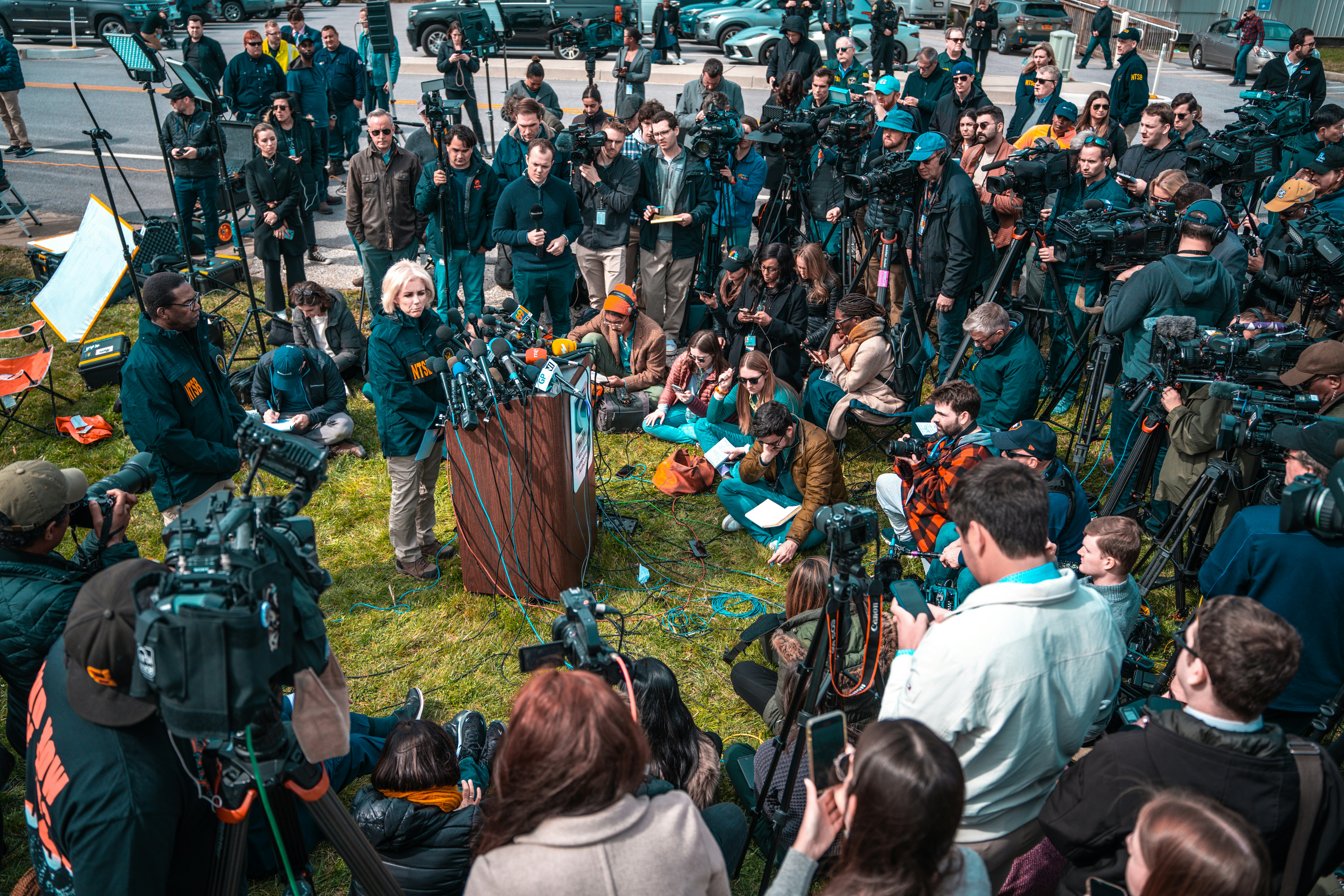 Reporter at press event with microphones