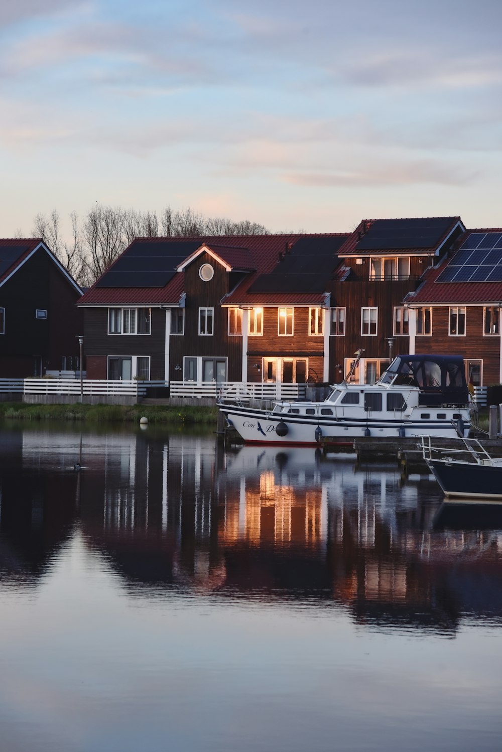 a row of houses next to a body of water