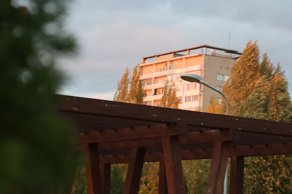 a street light sitting on top of a wooden bridge