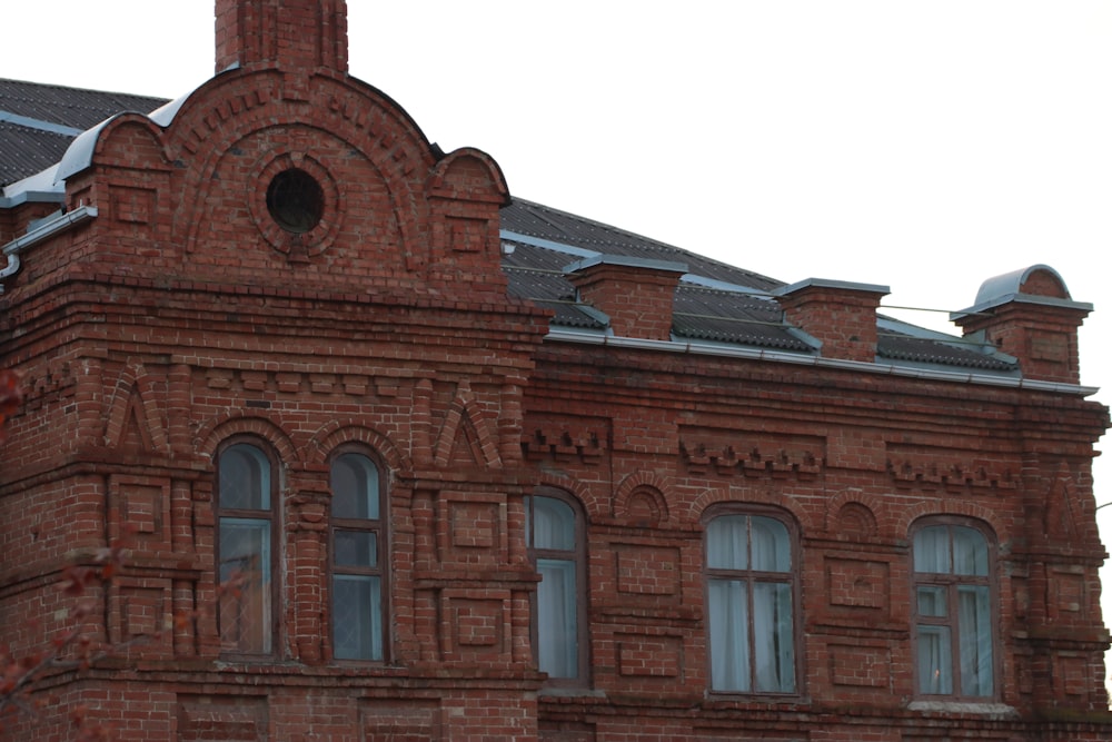 an old brick building with a clock tower