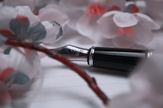 a pen sitting on top of a piece of paper