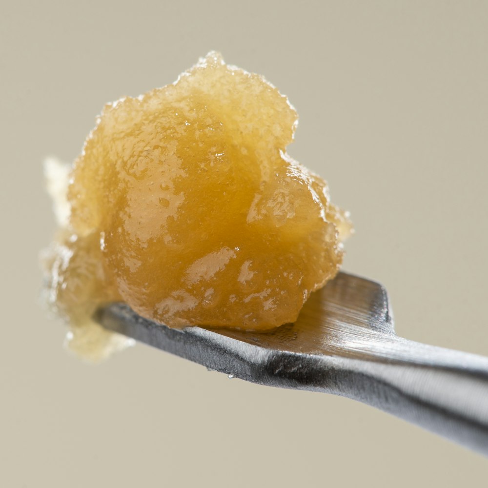 a close up of a spoon with sugar on it