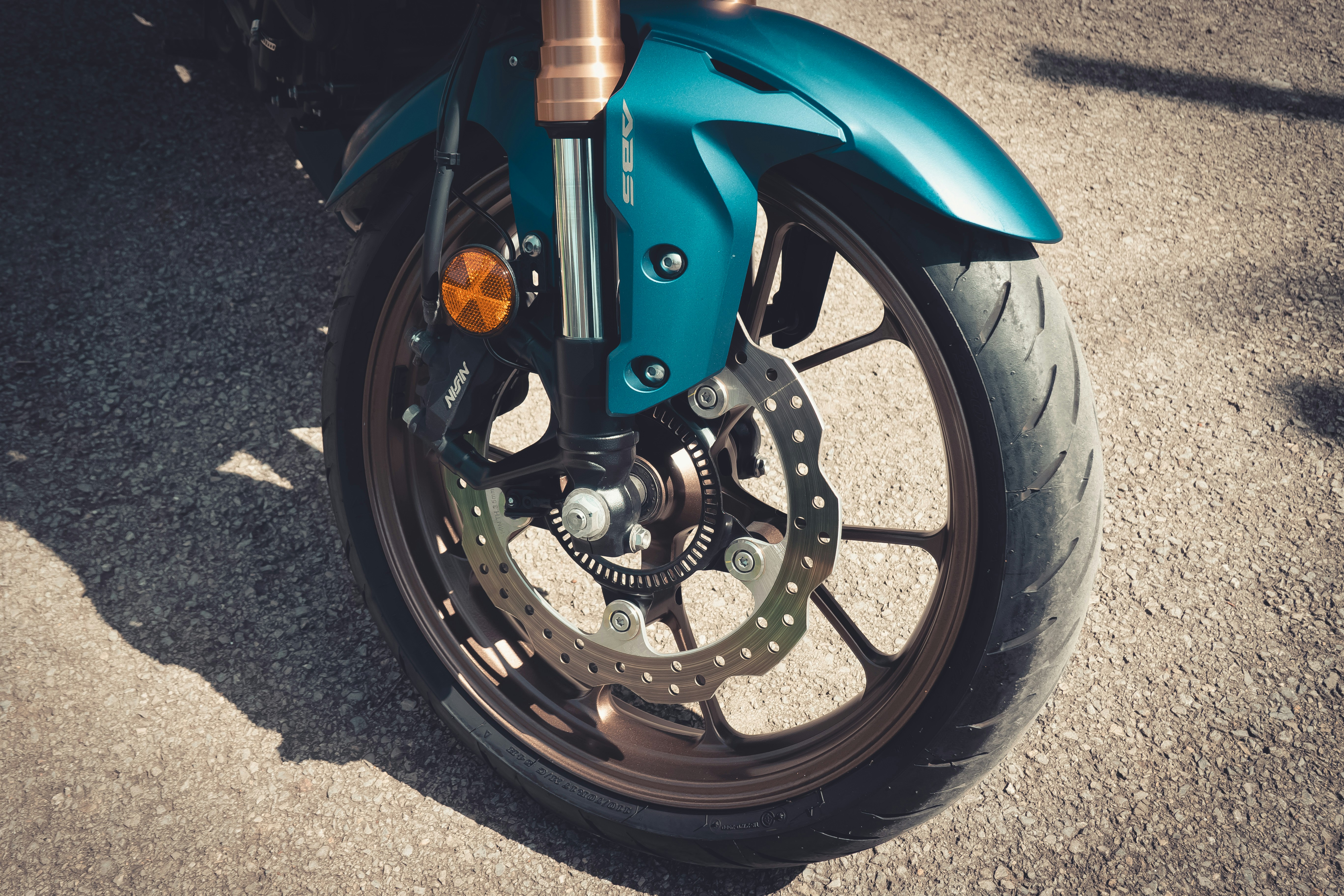 Honda CB250R blue, retro style street photos of a 2023 model bike