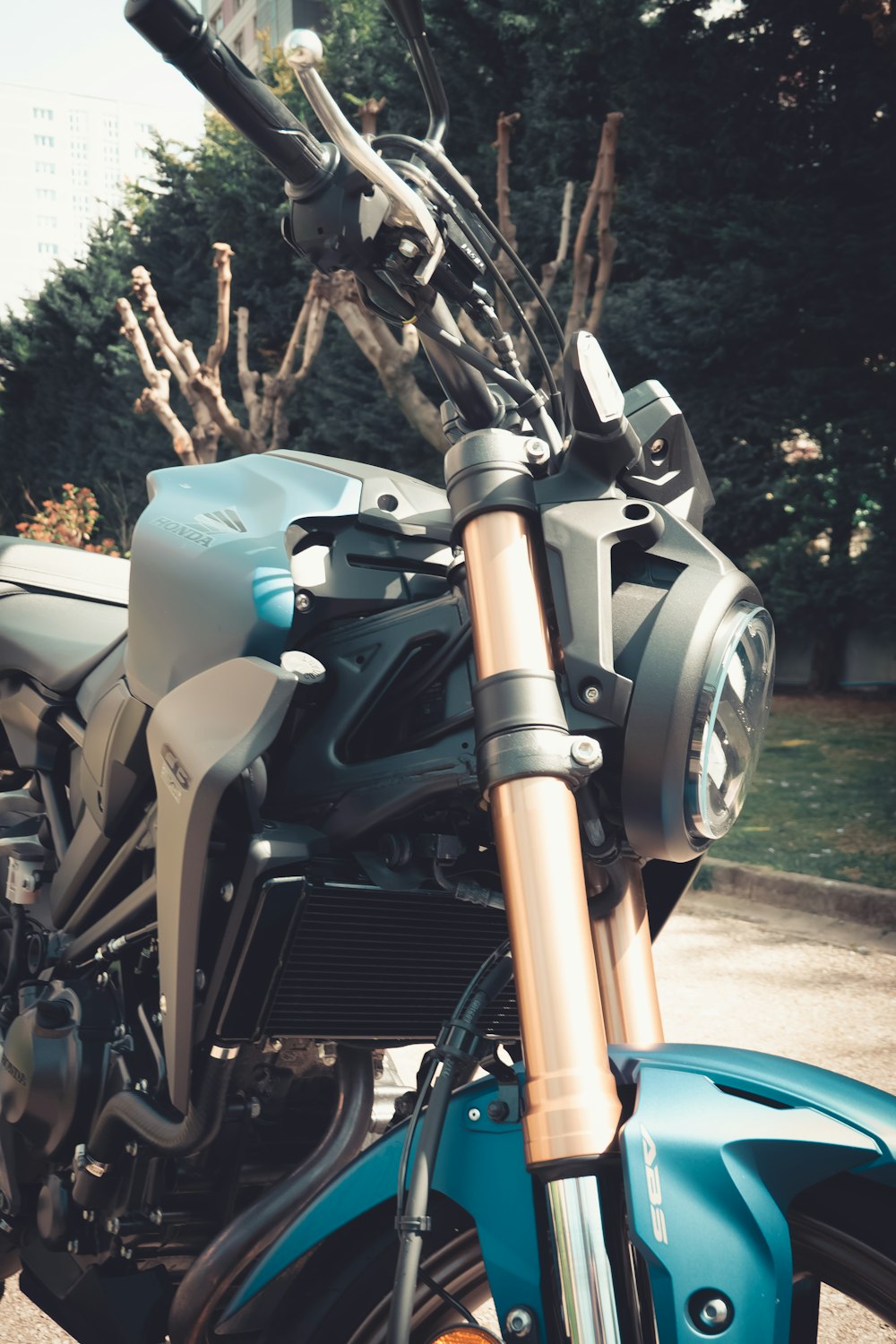 a close up of a motorcycle parked in a parking lot