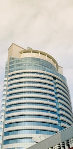 a very tall building with a clock on it's side