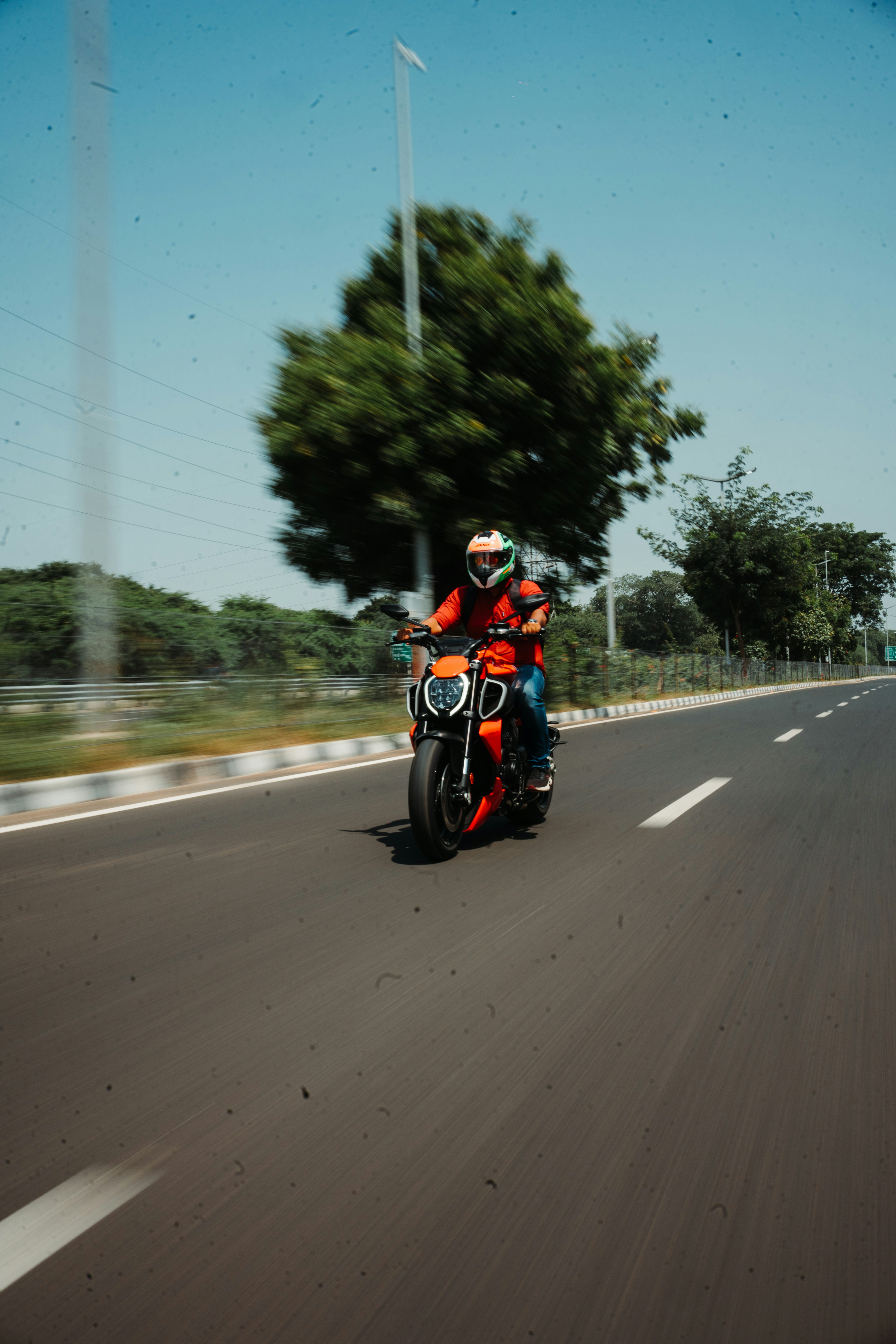 a man riding a motorcycle down a curvy road