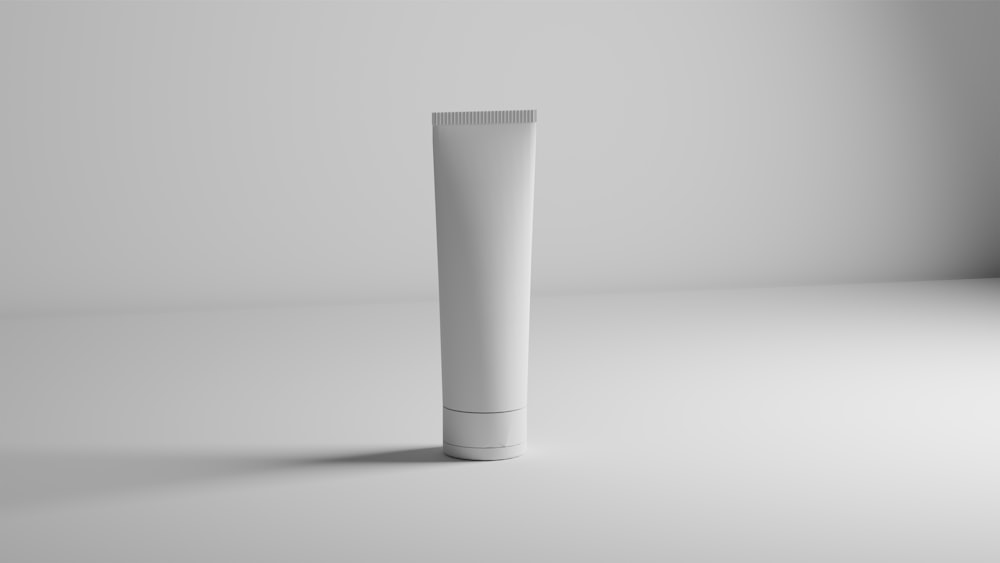 a tube of toothpaste on a white surface