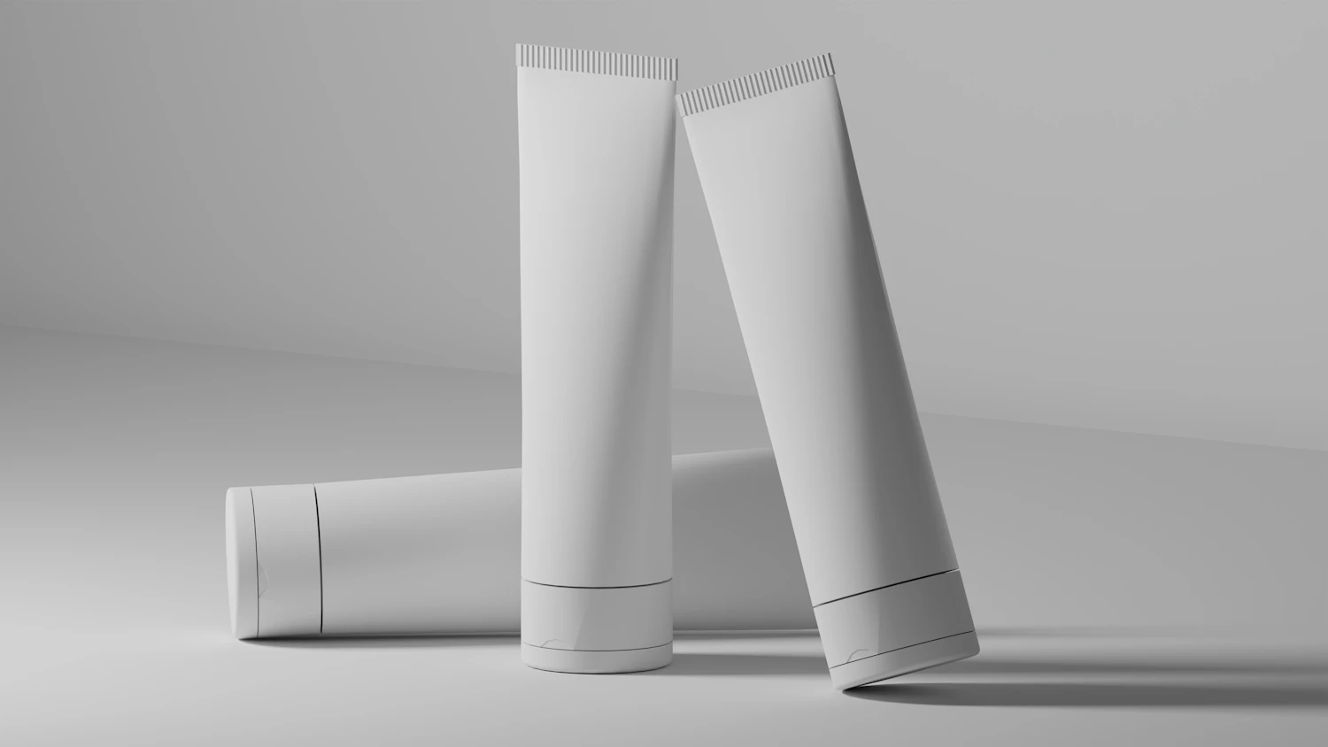 Urea 10% Body Cream, in stock — three white tubes leaning together on grey