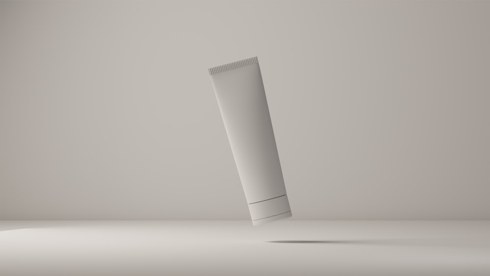 a tube of toothpaste on a white surface