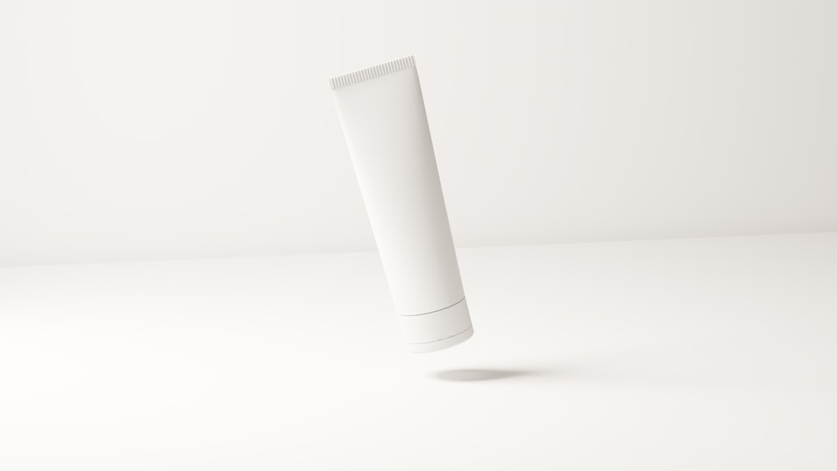 A plain unlabelled cosmetic tube on a white surface