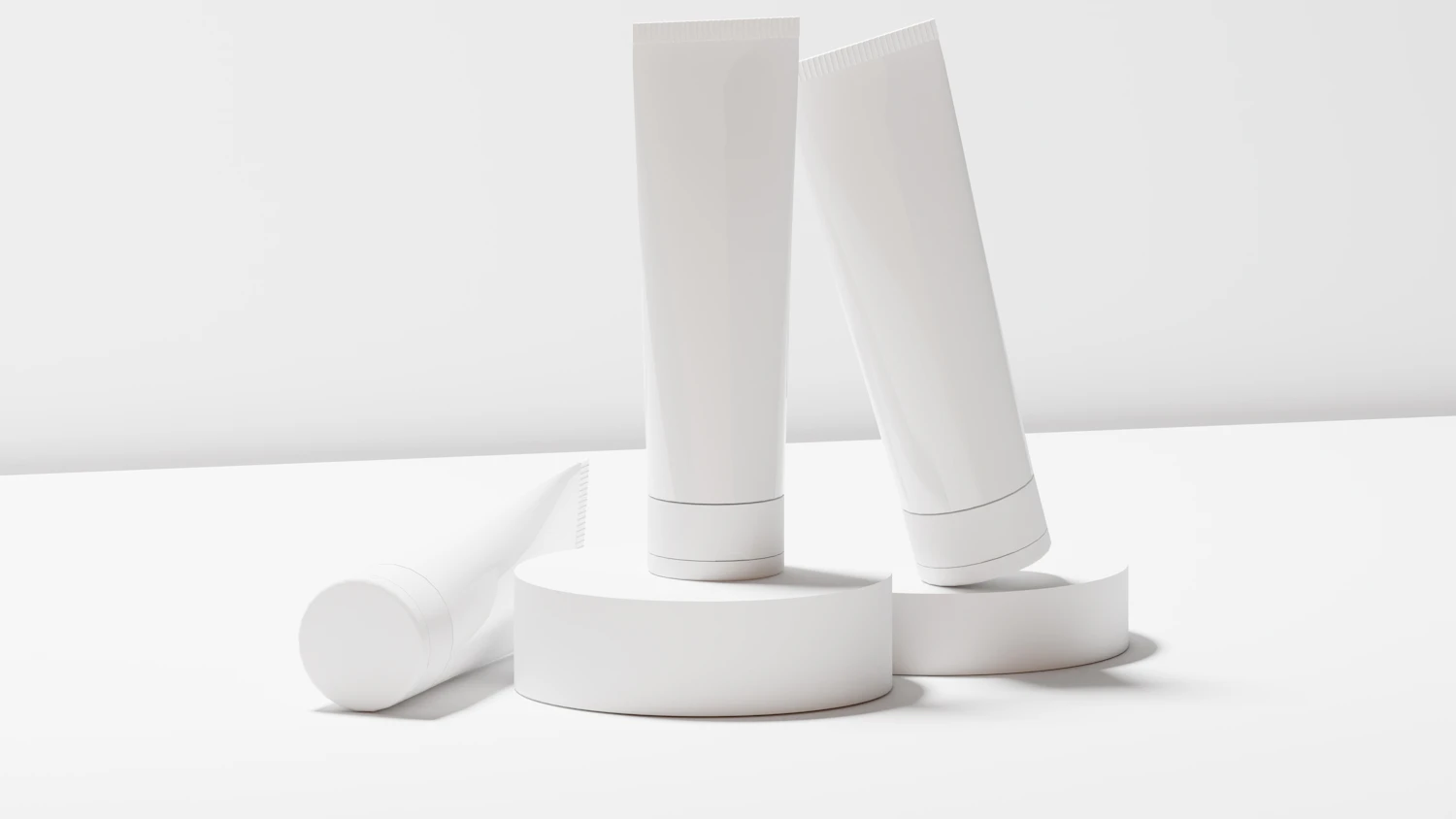 Mineral SPF 50 Fluid, in stock — two white tubes standing on white discs