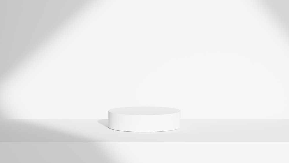 a white round object on a white surface