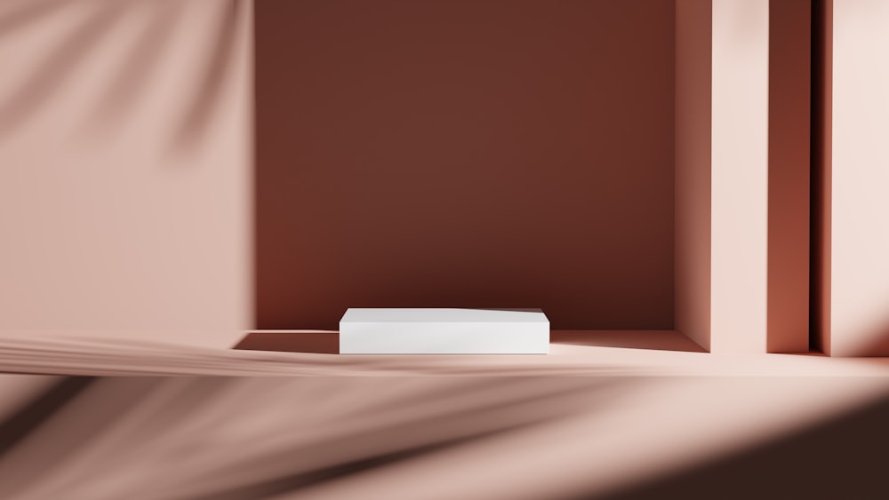 a white box sitting in a corner of a room