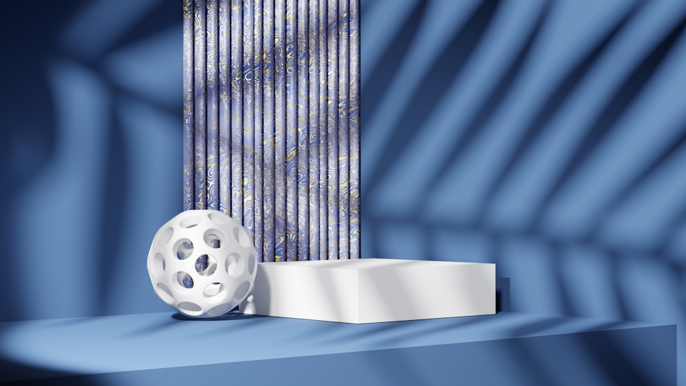 a white film reel sitting on top of a blue shelf