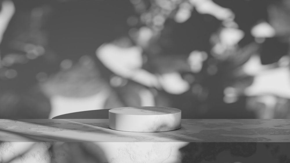 a white object sitting on top of a wooden table