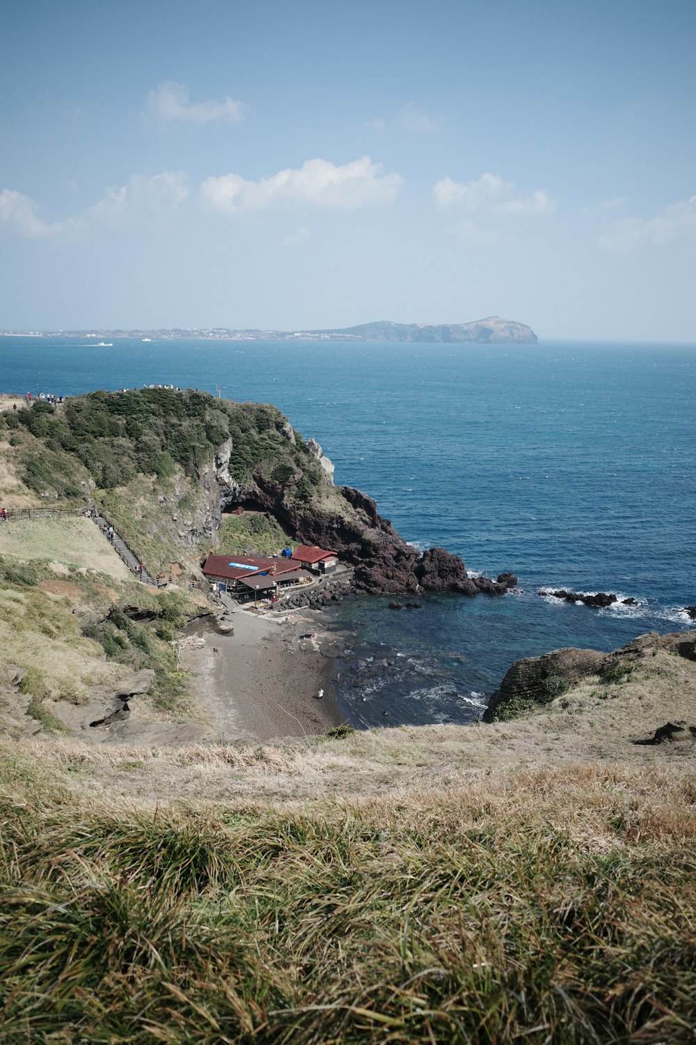 a view of the ocean from a hill