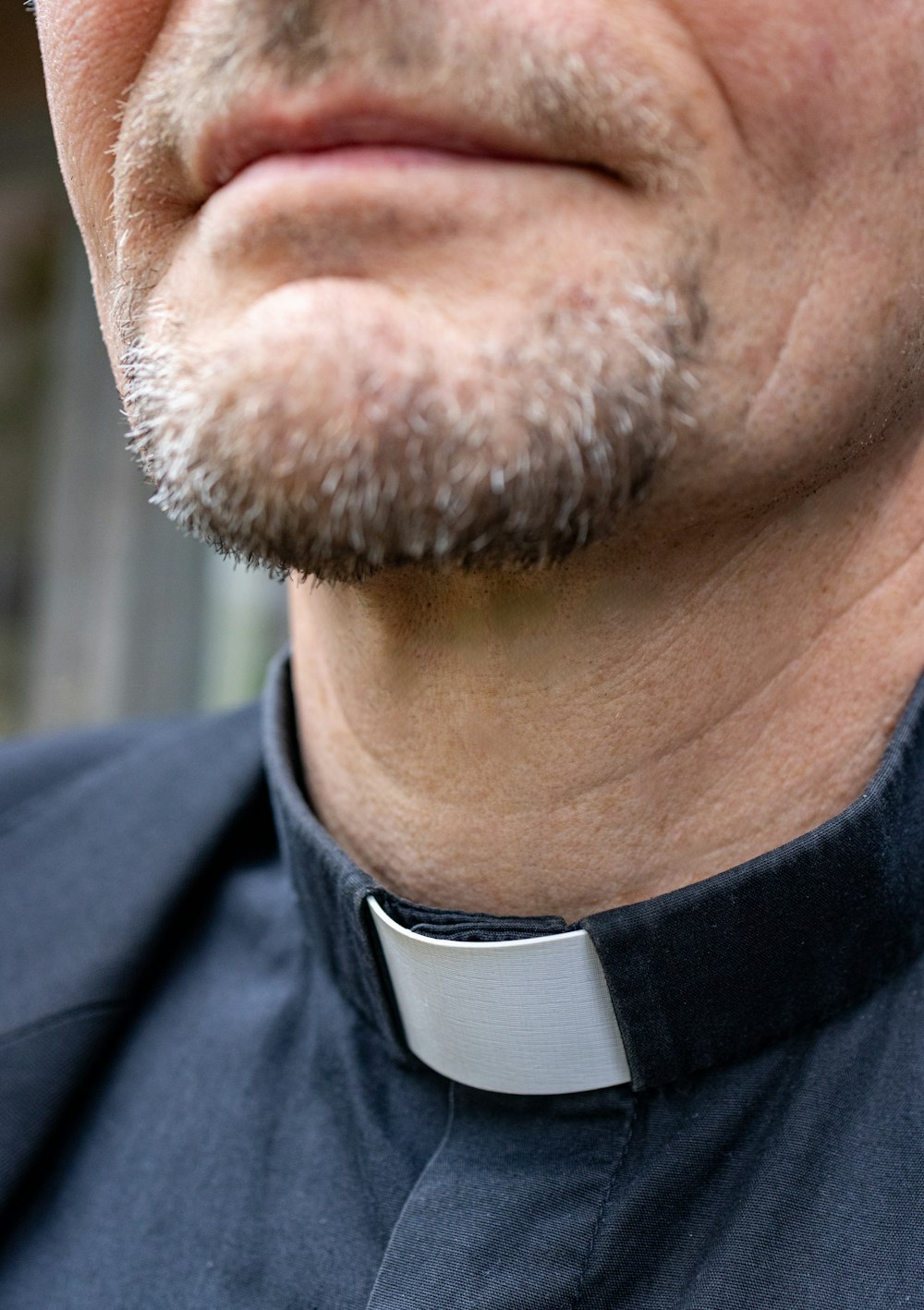 a close up of a man wearing a neck tie