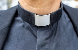 a close up of a man wearing a neck tie