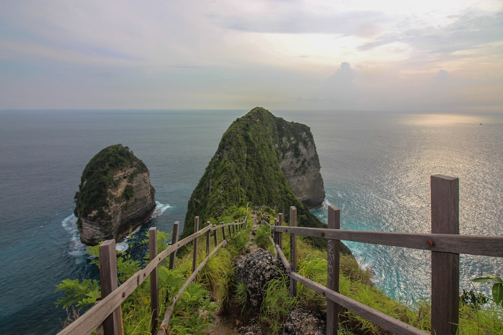 a wooden path leading to the top of a mountain