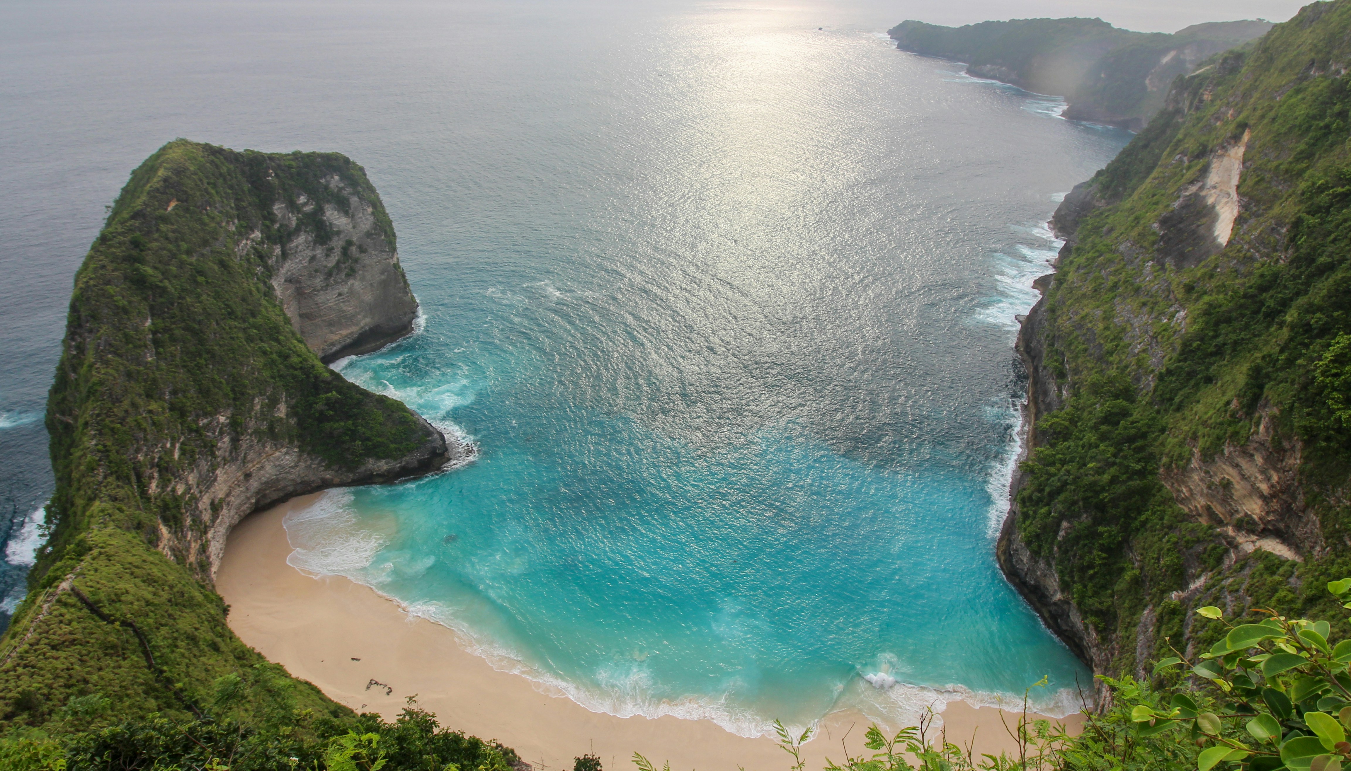 a view of the ocean from the top of a mountain