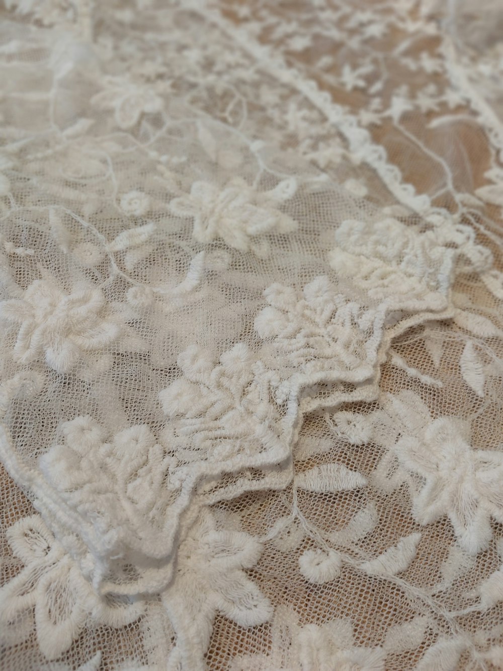 a close up of a lace fabric with flowers on it