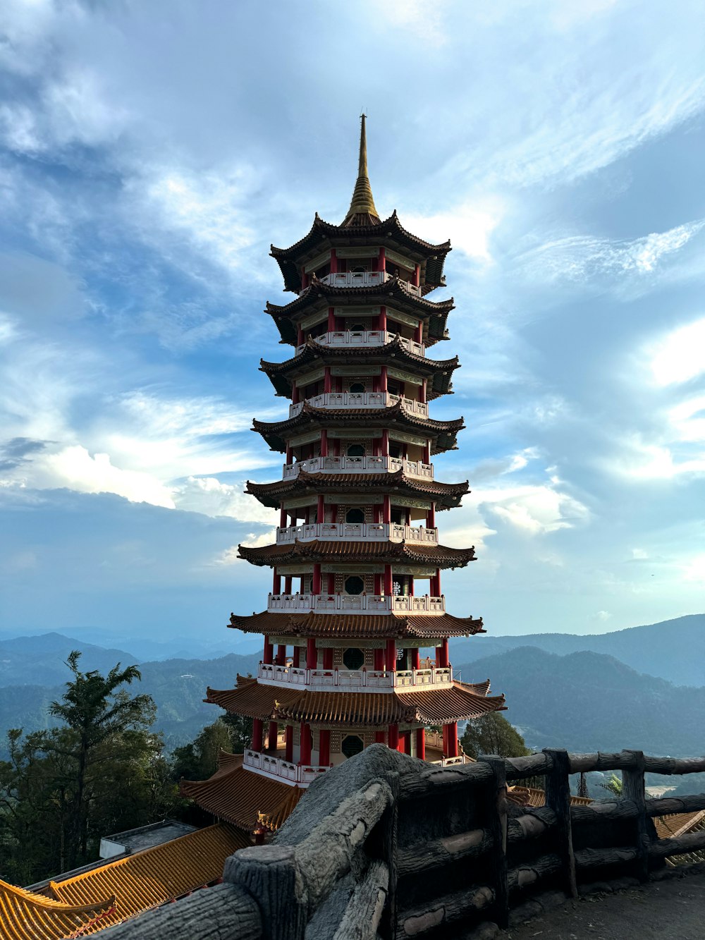 a tall tower sitting on the side of a mountain