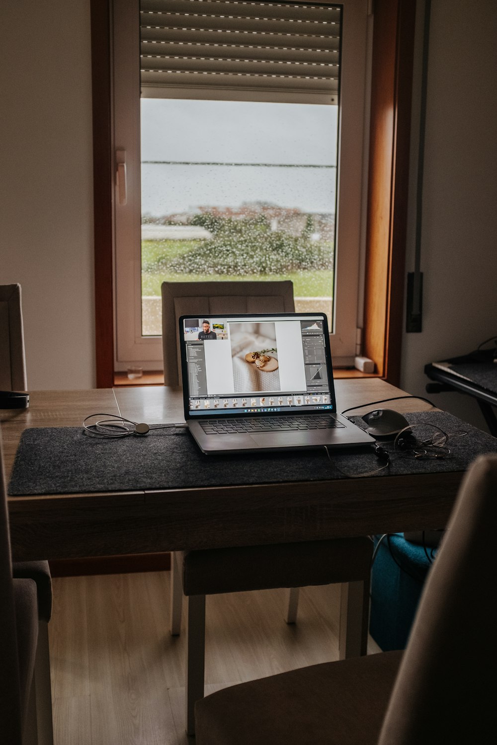 a laptop computer sitting on top of a wooden desk