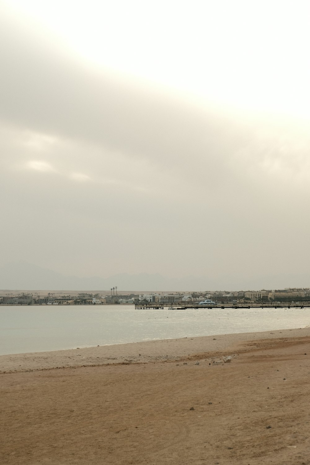 a man is flying a kite on the beach