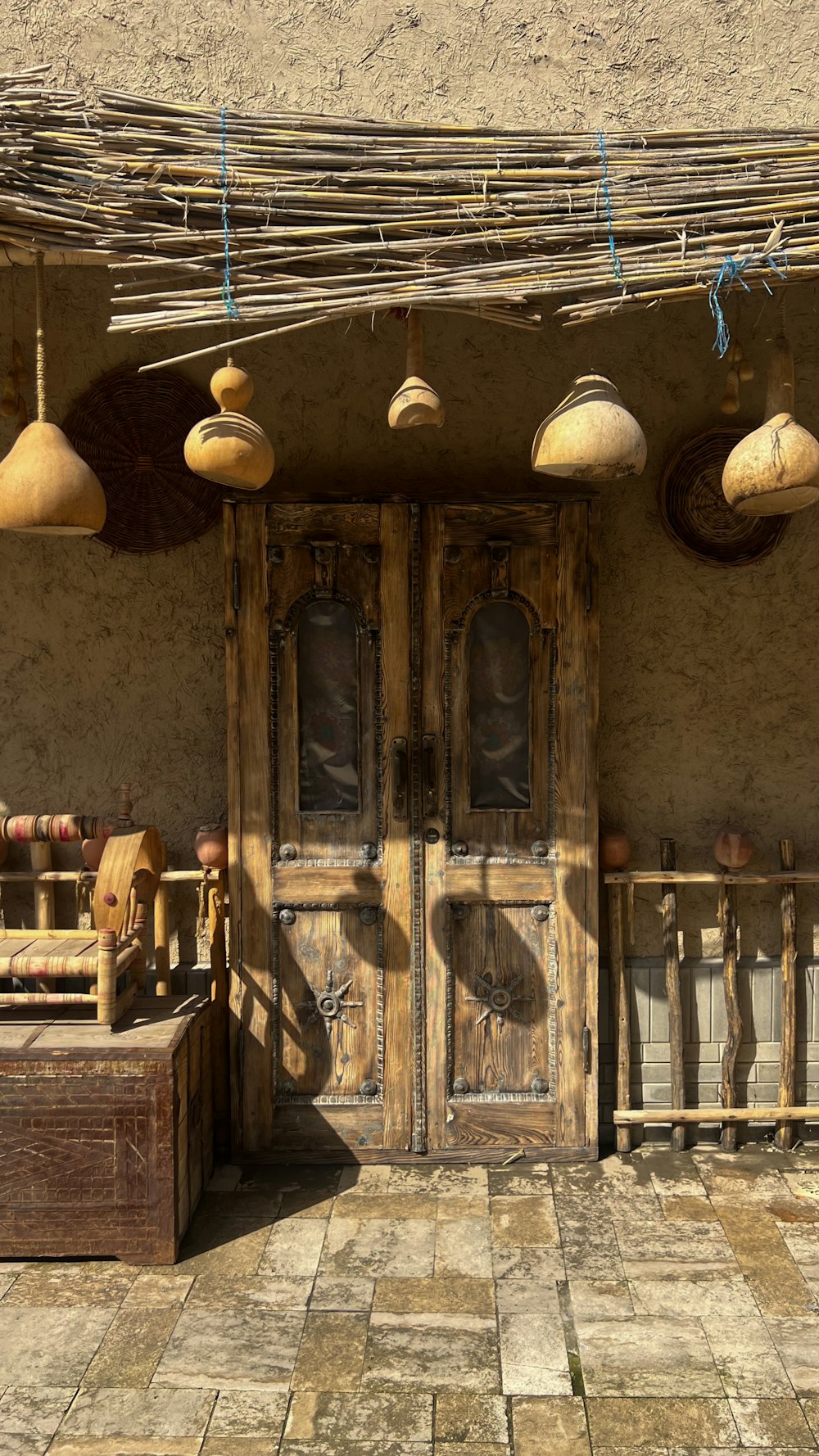 a wooden door sitting next to a building