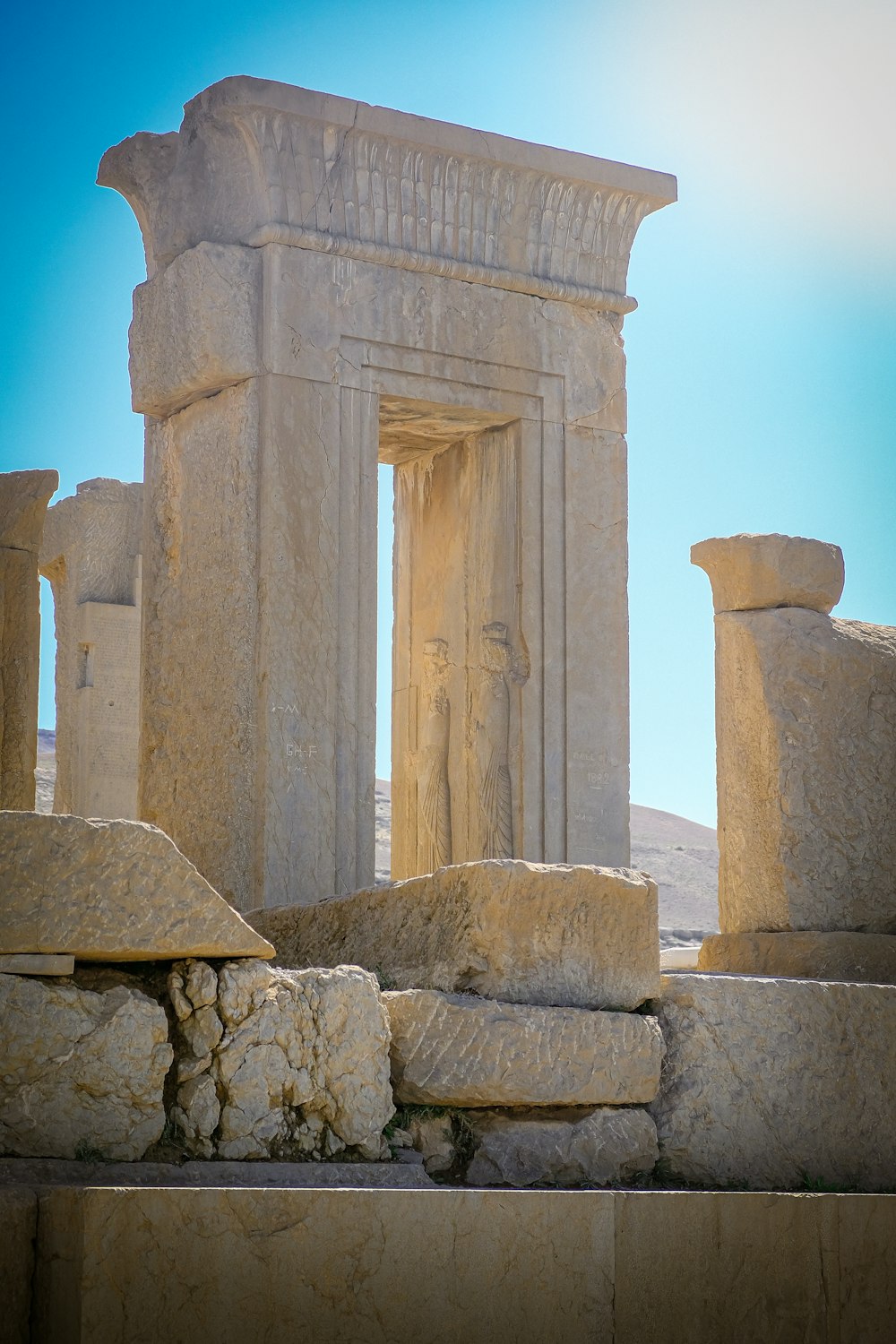 a large stone structure with a door in the middle of it