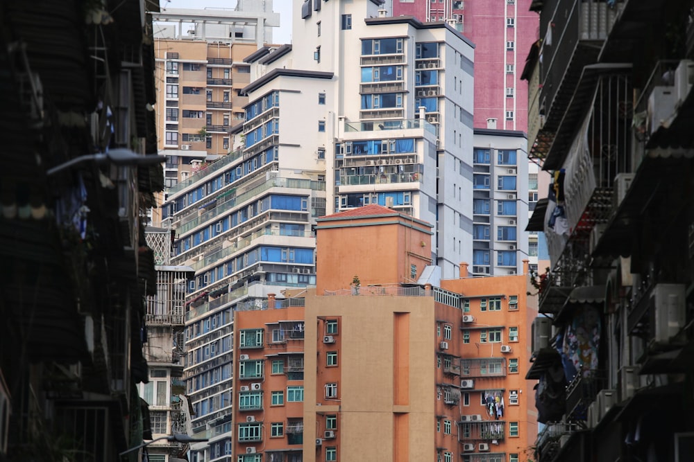 a city street with tall buildings in the background