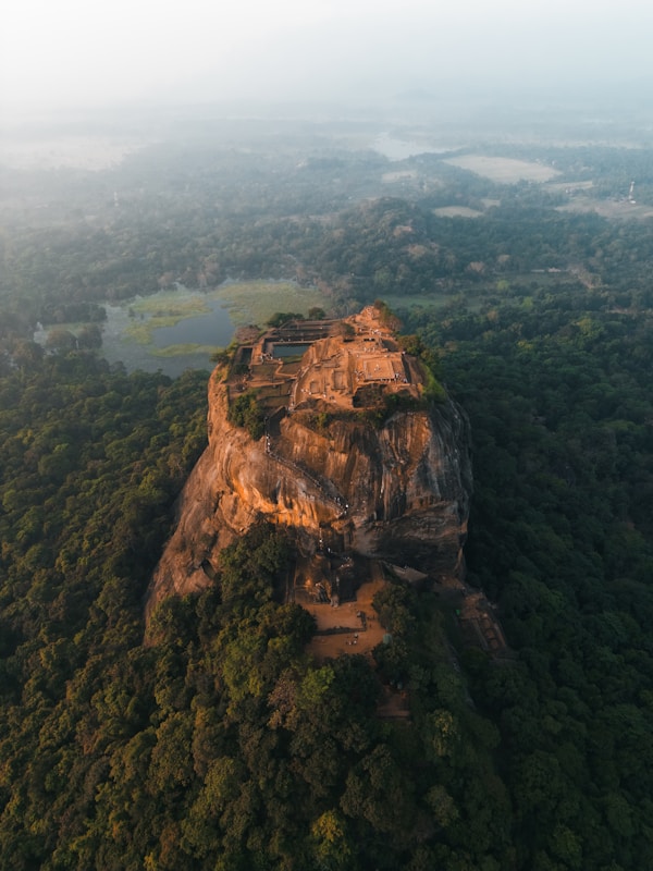 Aerial view of Sigiriya rock fortress rising from the forest, Sri Lanka