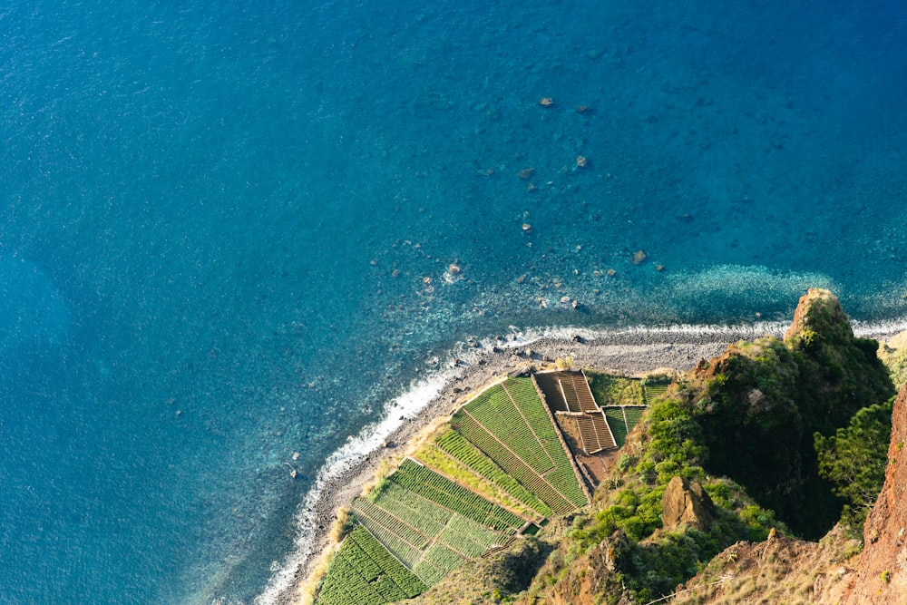 an aerial view of a beach and a cliff