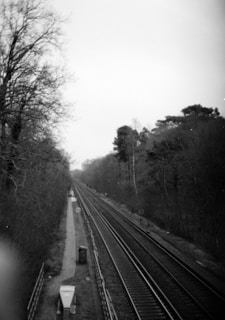 a black and white photo of a train track