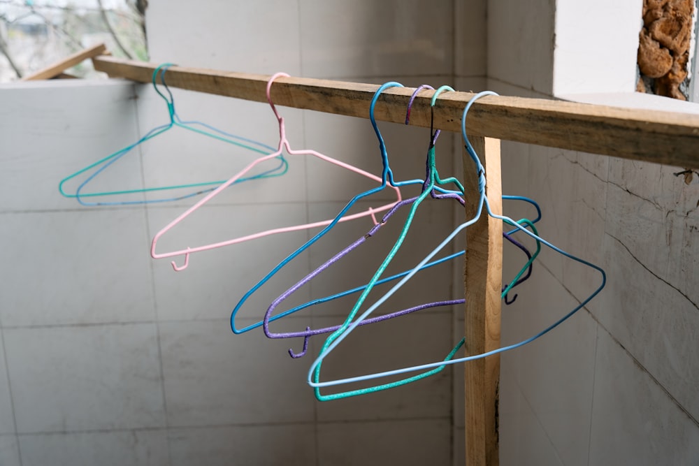 a row of clothes hangers in a bathroom