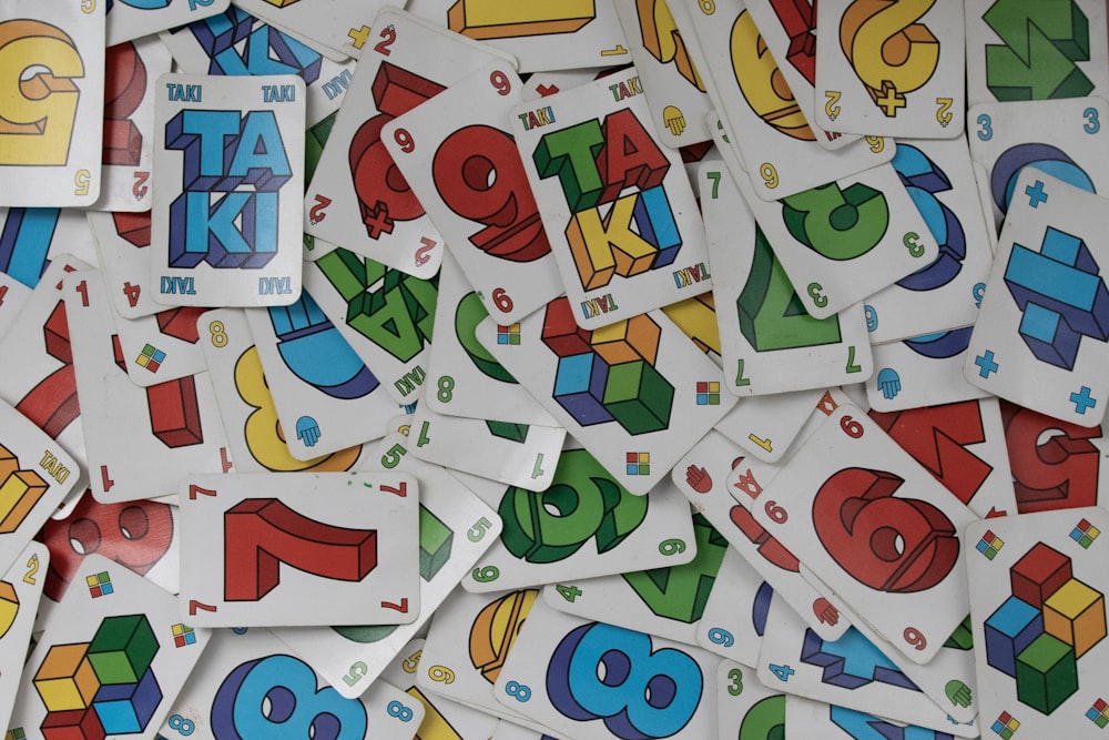 a pile of stickers with numbers and letters on them