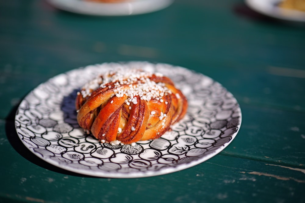 a plate topped with pastries covered in powdered sugar