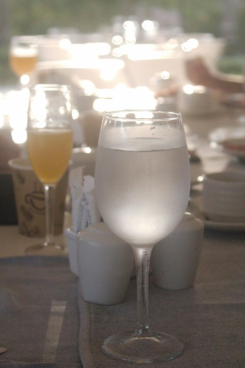 a close up of a wine glass on a table