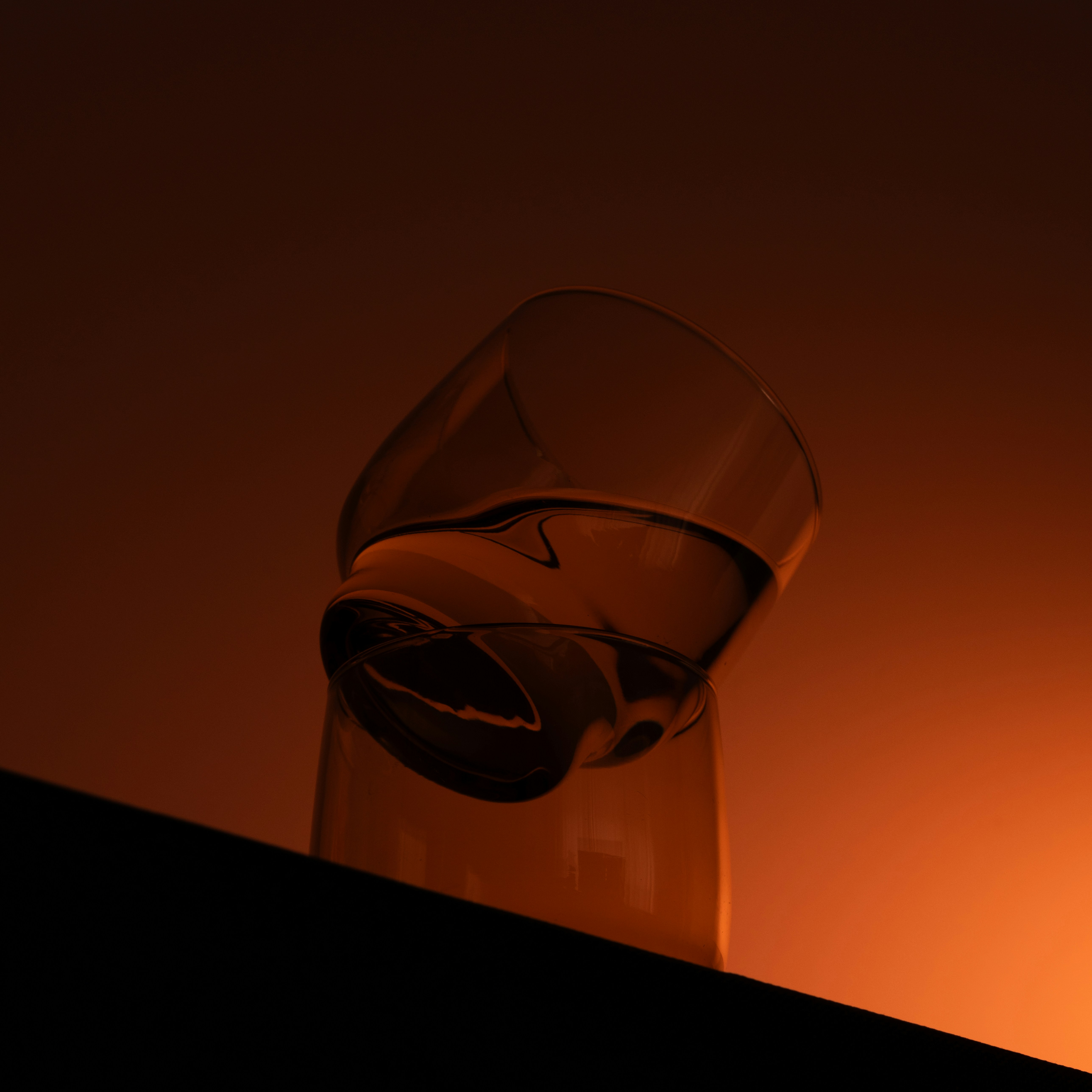 a glass sitting on top of a table