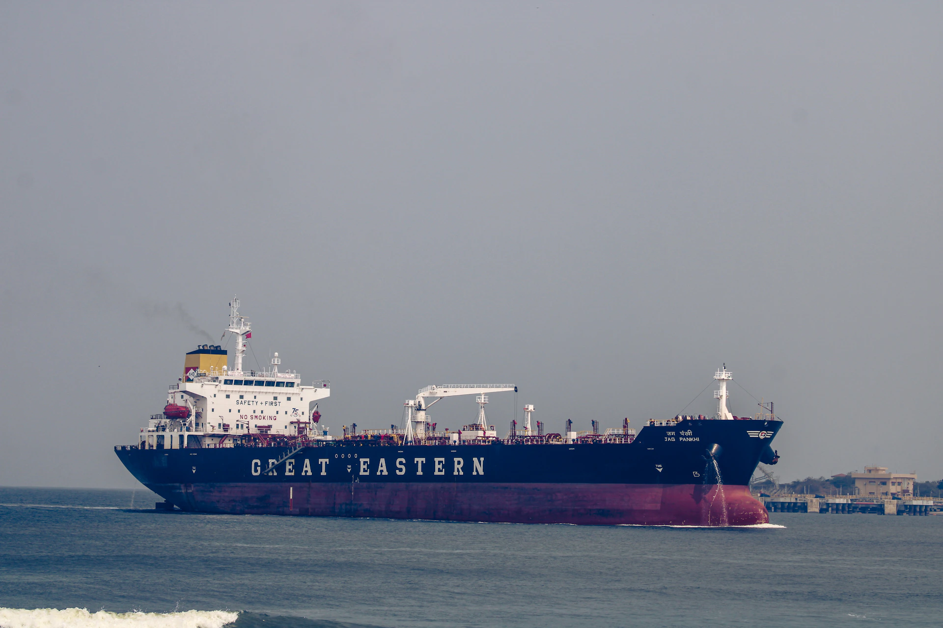 a large cargo ship in the middle of the ocean