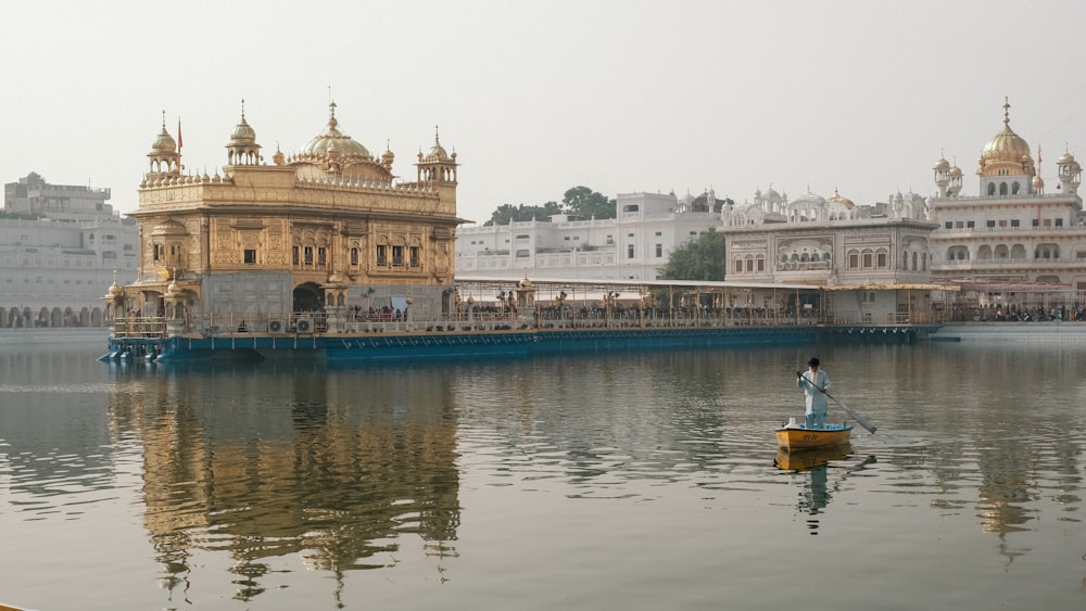 a person in a small boat on a body of water