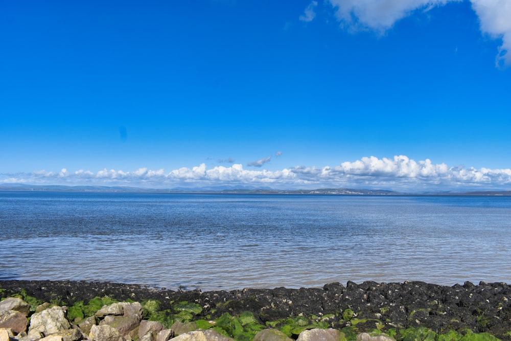 a large body of water surrounded by rocks