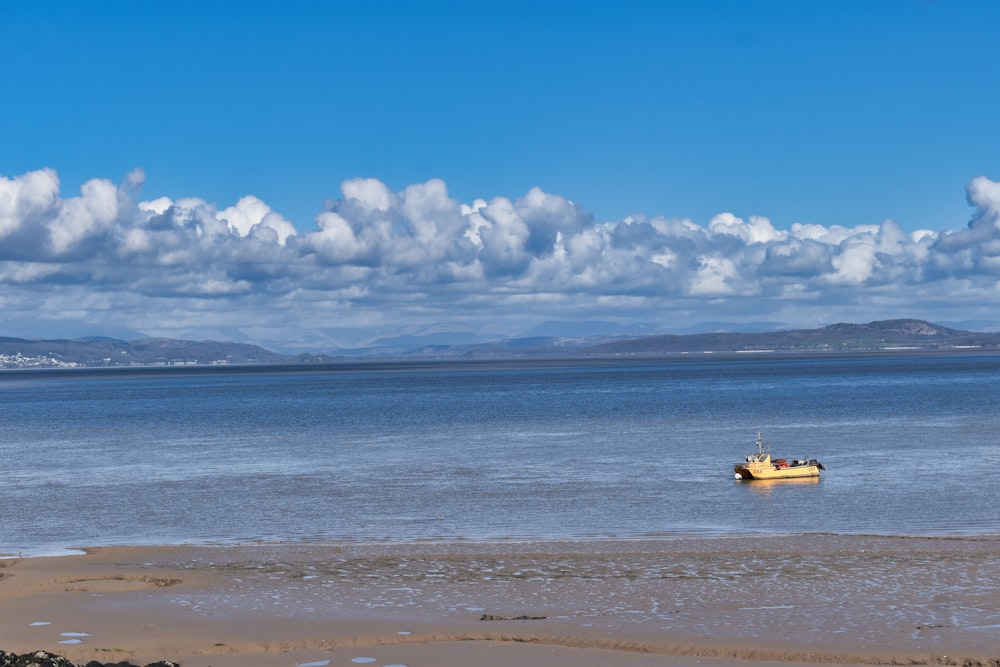 a boat floating on top of a large body of water