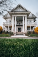 a large white house with columns and a porch