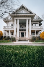 a large white house with columns and a porch