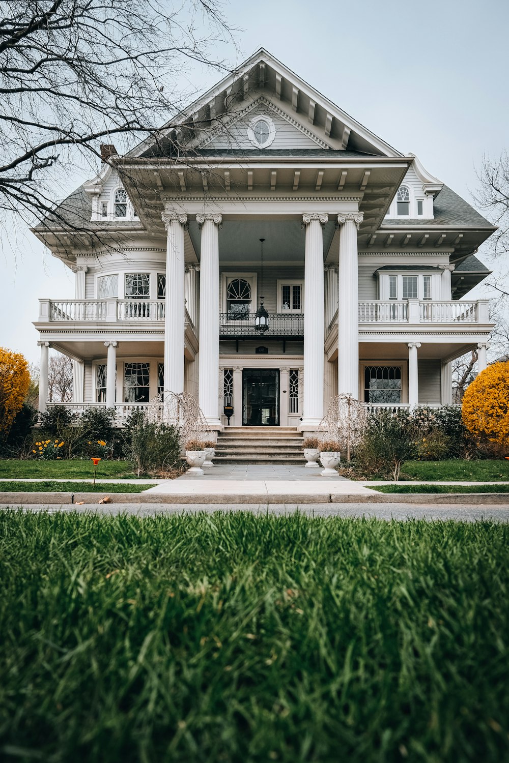 a large white house with columns and a porch