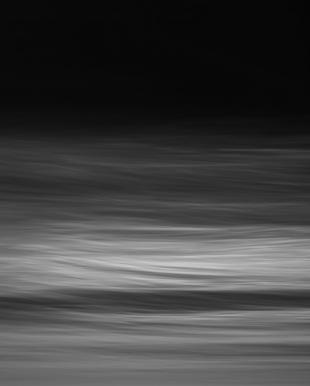 a black and white photo of the ocean