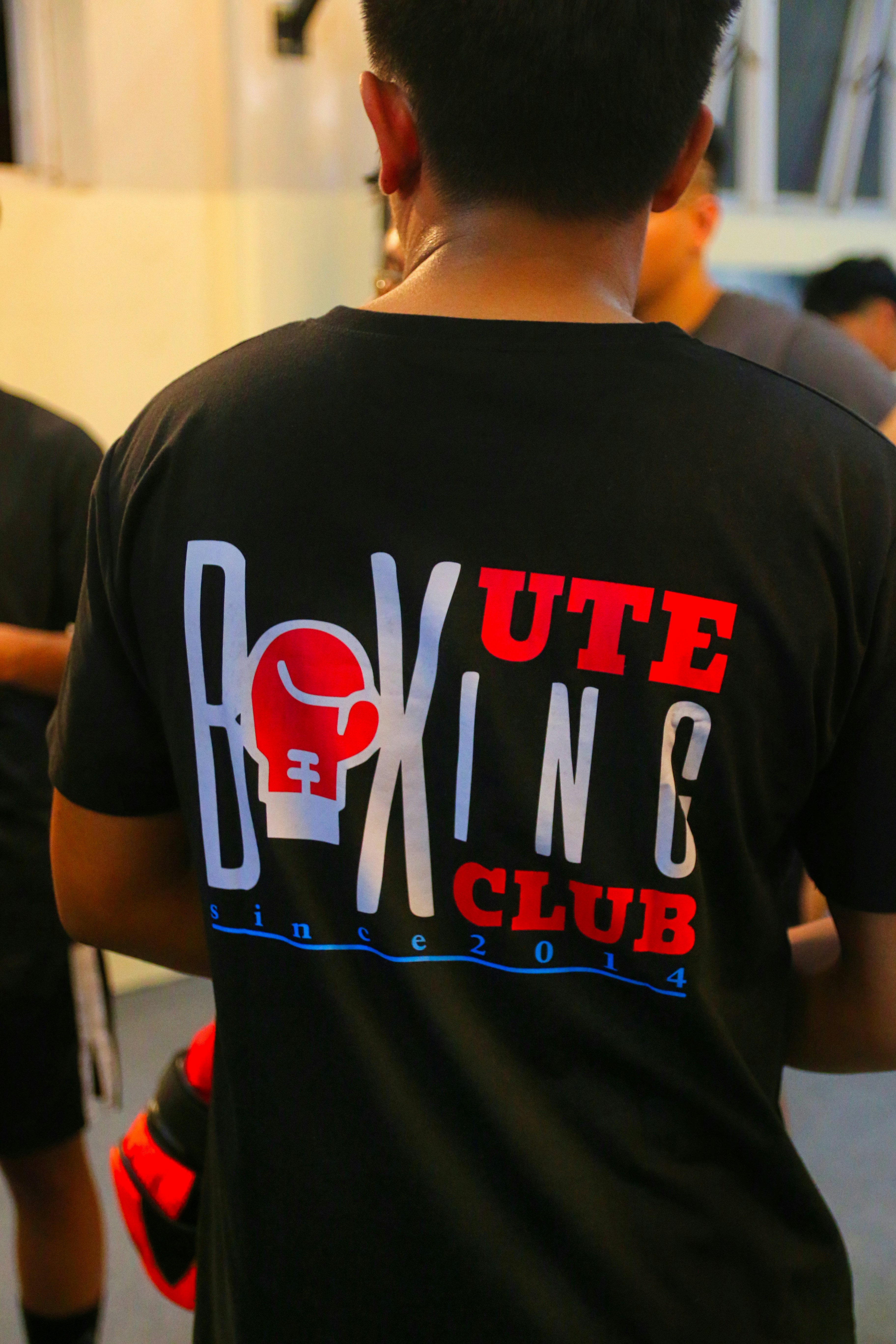 a young man holding a nintendo wii game controller